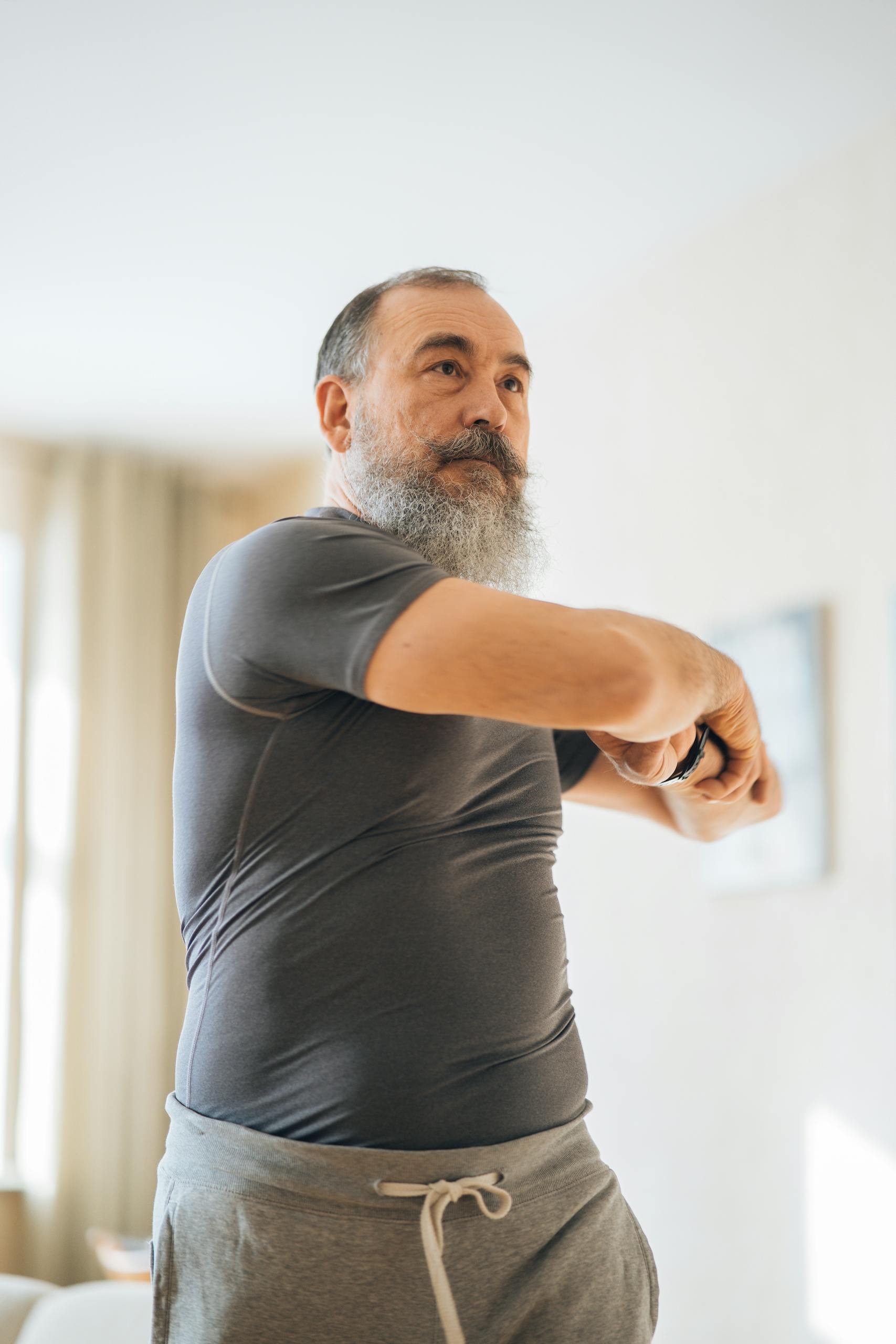 Man in Crew Neck T-shirt Doing Side Stretches